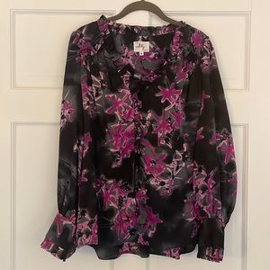 Milly Black silk blouse with pink accents. Button up front. Long sleeves.